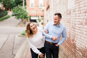 couple laughing together in engagement photo