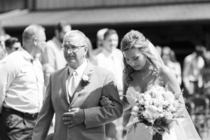 bride and father walk down the aisle