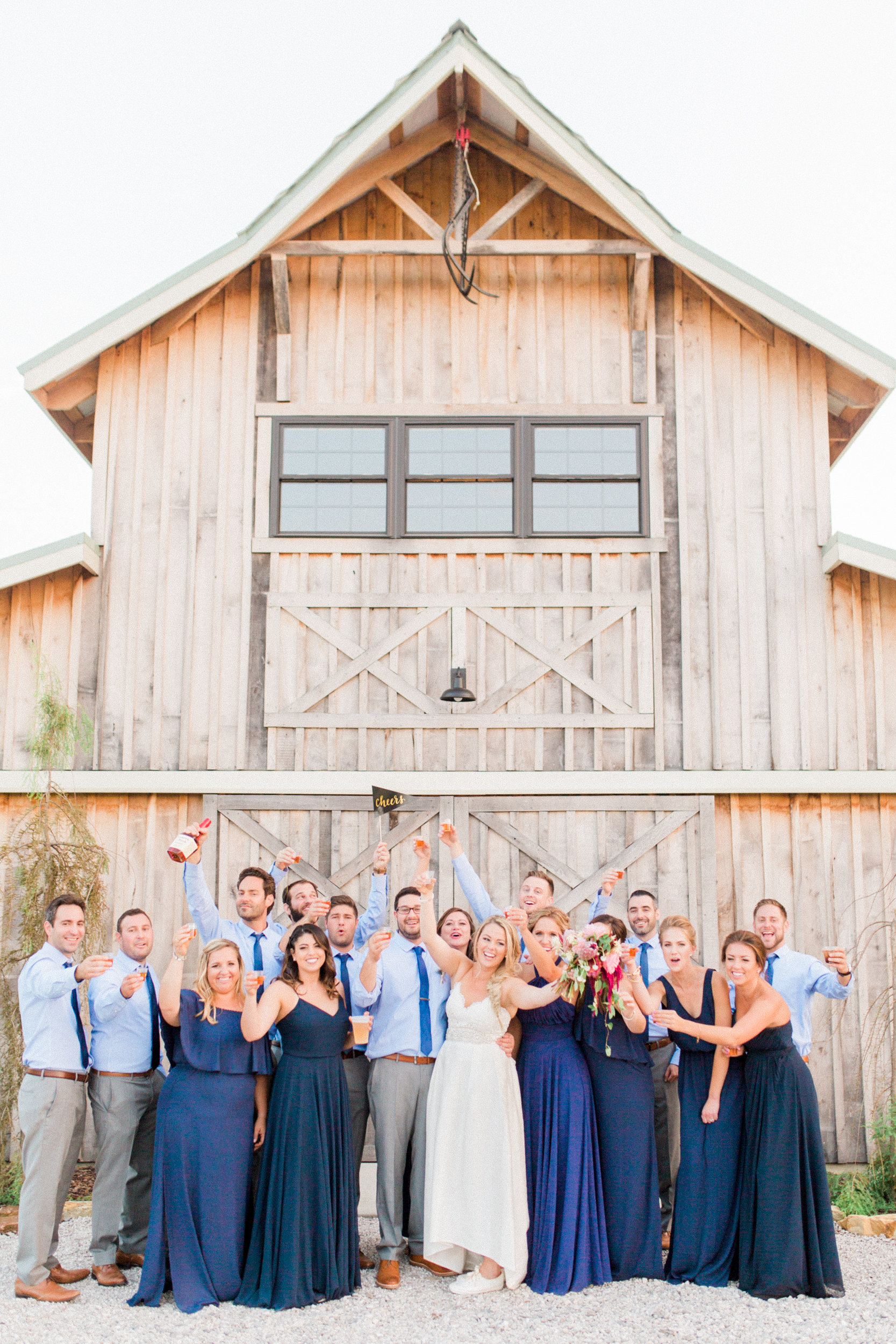 Wedding party outside of barn. Photographed by Morgan Williams Photography.