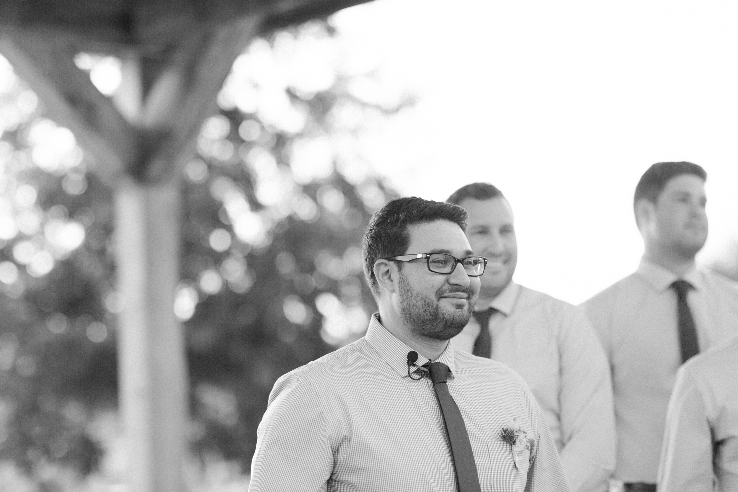 Groom's reaction to bride walking down the aisle. Photographed by Morgan Williams Photography