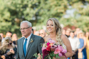 Bride and dad walking down the aisle. Photographed by Morgan Williams Photography
