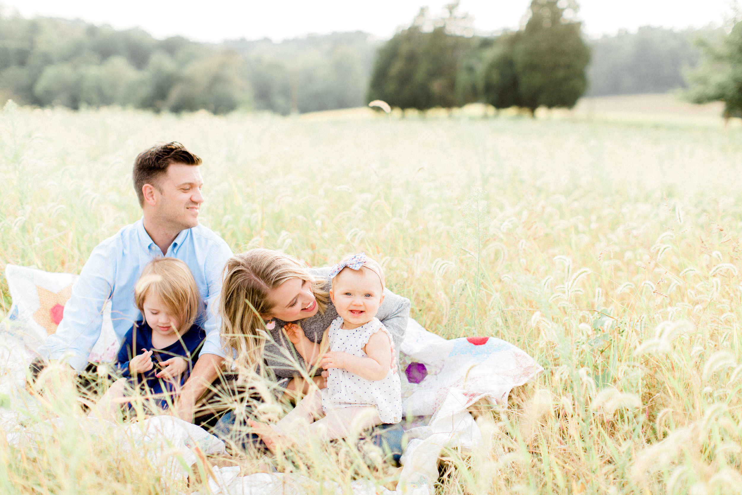Fall family photo in a field. Photographed by morgan williams photography.